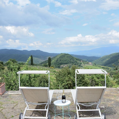 Sip a glass of wine as you drink in the far-reaching views