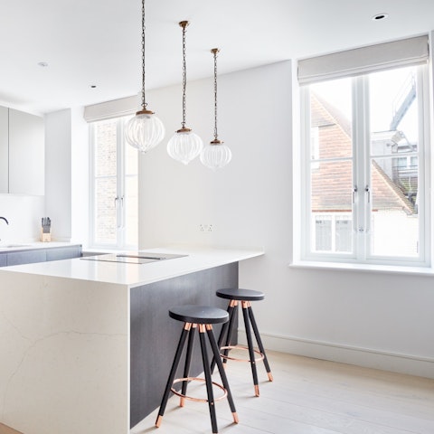 Dine in style under the pendant lights by the huge windows