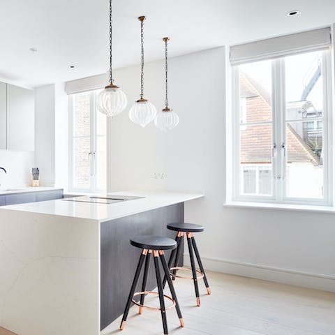 Dine in style under the pendant lights by the huge windows