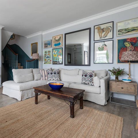 Admire the eclectic artwork and wallpaper throughout this mews house