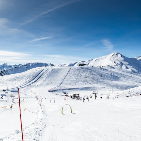 Jump on the cable car, a five-minute walk away, and hit the slopes