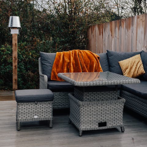 Get cosy under the outdoor blankets on the terrace