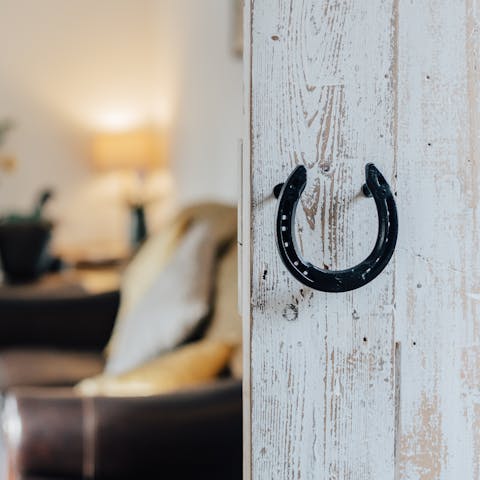 Admire equine decor touches, a reminder of the building's former life