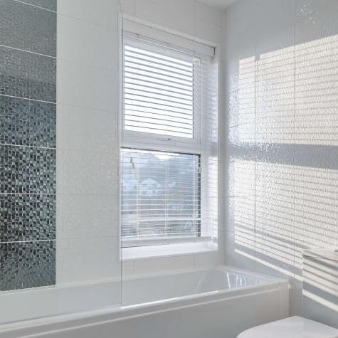 Treat yourself to an unrushed soak in the pristine bathtub