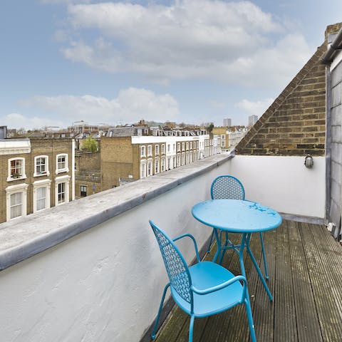 Have a glass of Champagne at sunset on the top floor balcony