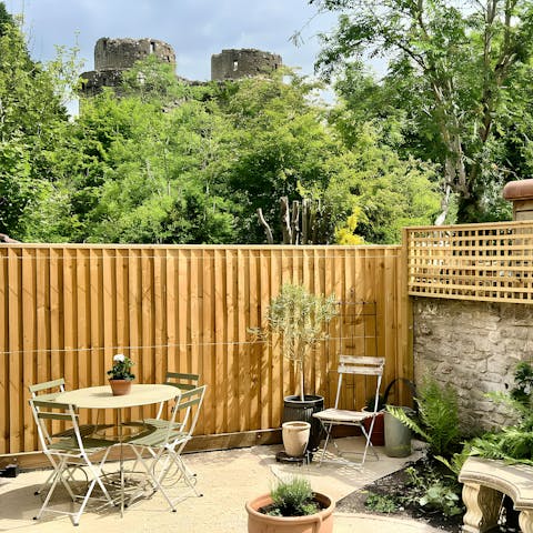 Unwind in the private garden with views of Nunney Castle