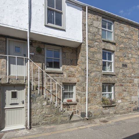 Stay in a period cottage just a few metres from the sea