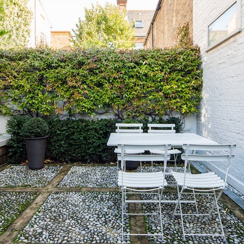 Enjoy balmy evenings out in the peaceful courtyard garden