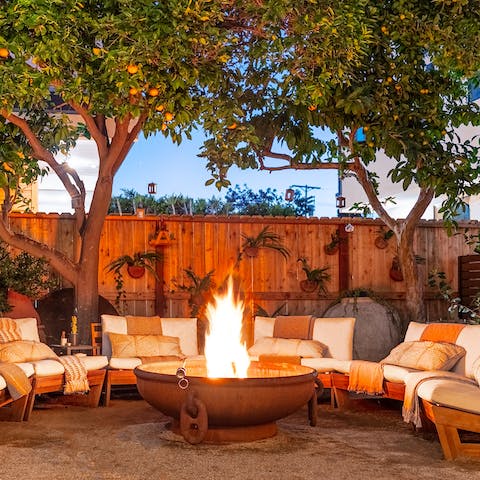 Gather around the firepit to toast marshmallows with a glass of wine