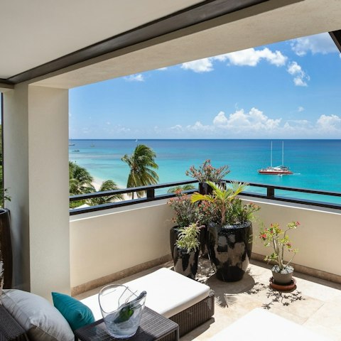 Spill directly onto the covered terrace overlooking the sea