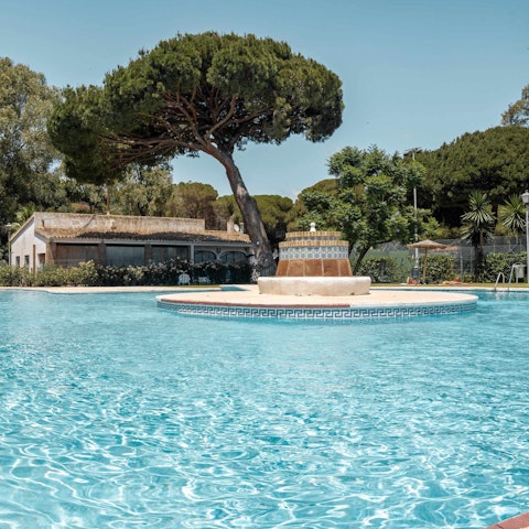 Dive into the communal swimming pool to beat the Spanish heat