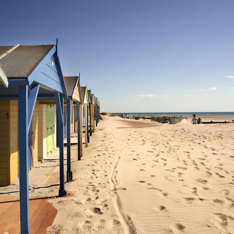 Sink your feet into the sand at East Wittering beach, a short stroll away
