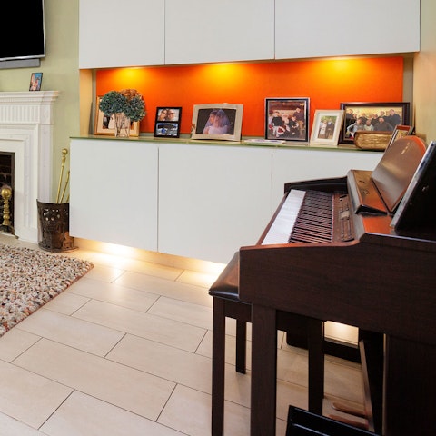 Tickle the ivories on the small piano in the lounge