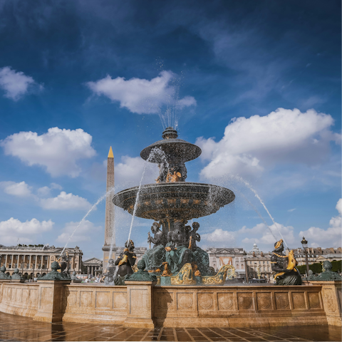 People watch on the Place de la Concorde