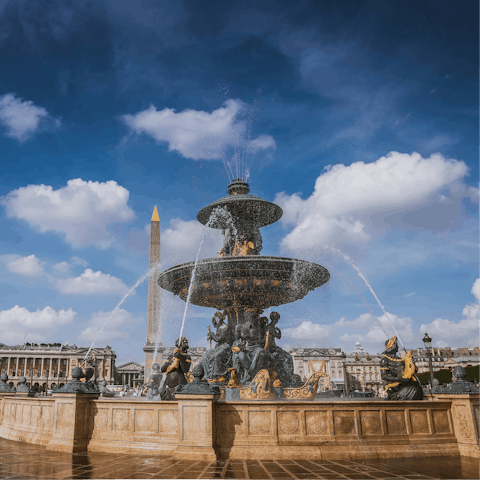People watch on the Place de la Concorde