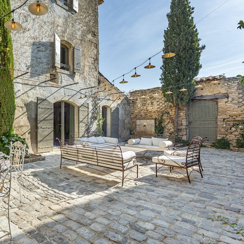 Sip local rosé in the pretty stone courtyard