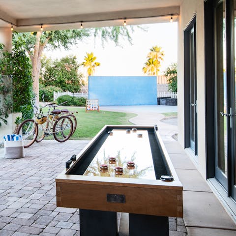 Enjoy some friendly competition on the air hockey table