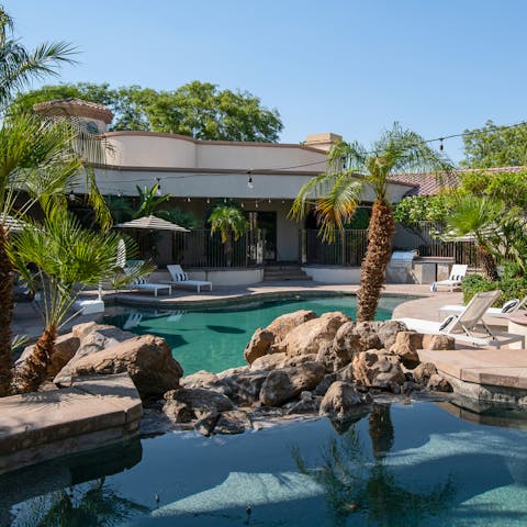 Feel as though you're in a tropical lagoon in the free form swimming pool