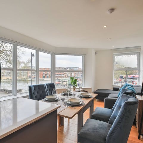 Unwind in the open-plan living room with views of the River Thames