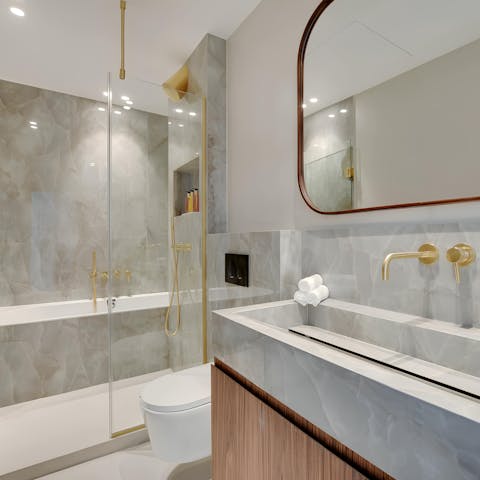 Go for a soak in the marble-clad bathroom
