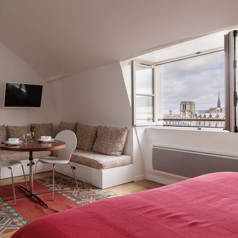 Roll out of bed and drink in the views of Paris