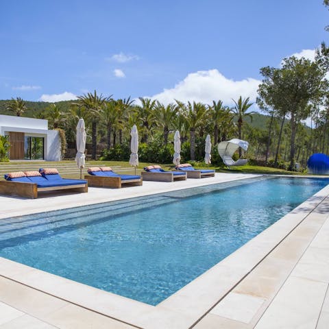 Experience total relaxation while lounging by the pool