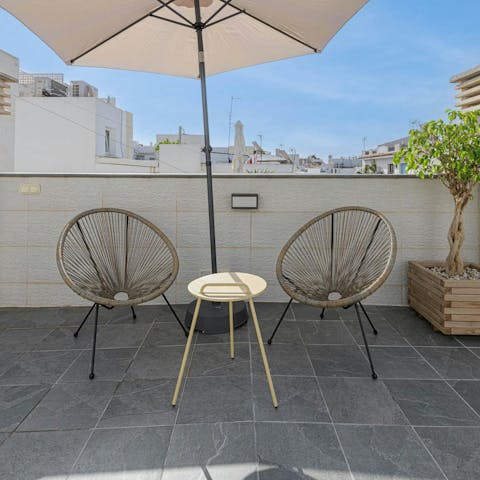 Enjoy a glass of tinto de verano on the shared terrace