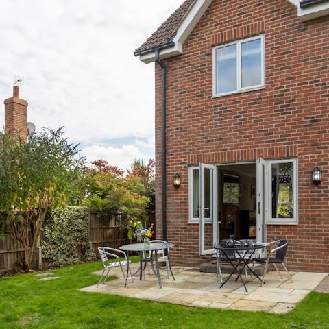 Enjoy a cup of tea in the charming garden and patio area