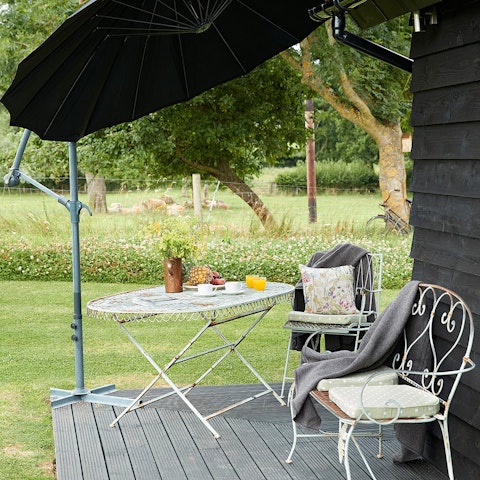 Unwind in the garden on the private deck overlooking the countryside