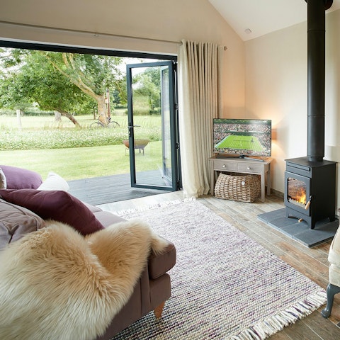 Relax in the bright living space that opens onto the garden