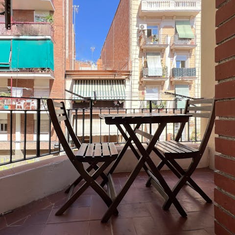 Sip your morning coffee on the balcony as the city wakes below