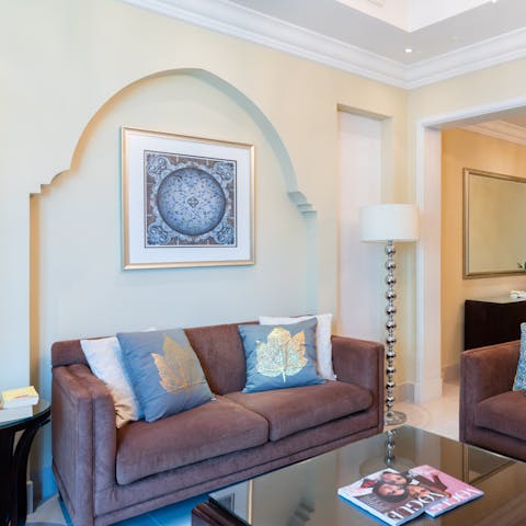 Stretch out in the living area after a day of exploring the city's sought-after sights