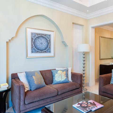 Stretch out in the living area after a day of exploring the city's sought-after sights