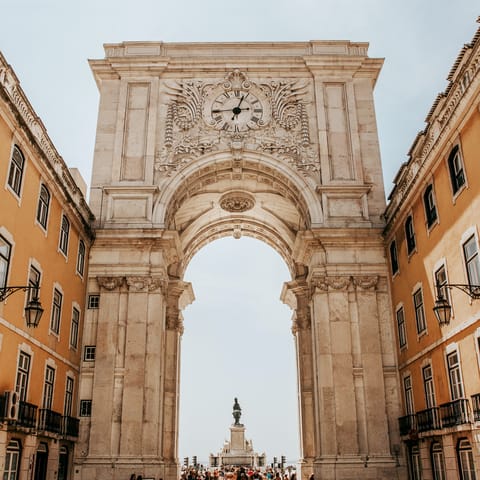 Make your way to the elegant and expansive Praça do Comércio – it's a twenty-minute riverside walk