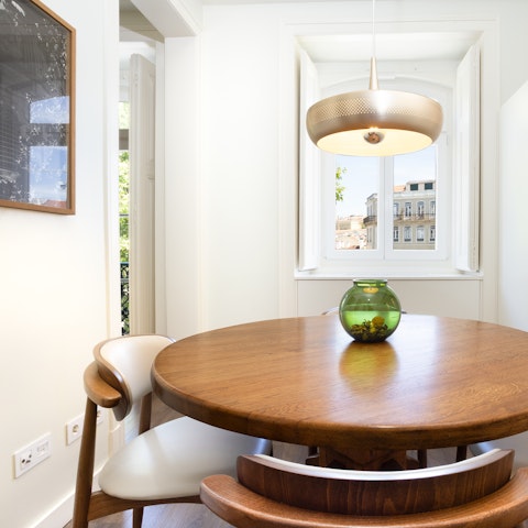 Gather together around the beautiful wooden dining table for sociable meals