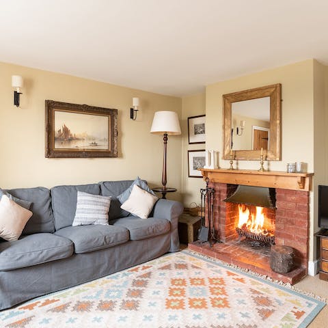 Choose your next read from the book shelf and get cosy beside the fireplace