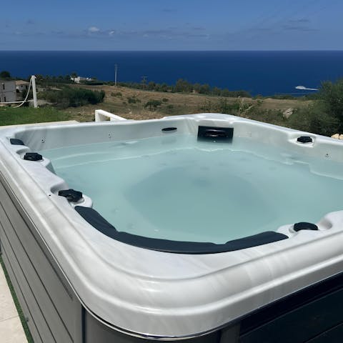 Enjoy a glass of Sicilian wine in the hot tub