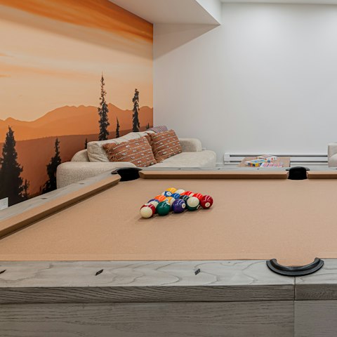 Sink the perfect shot while playing pool in the games room
