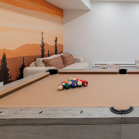 Sink the perfect shot while playing pool in the games room