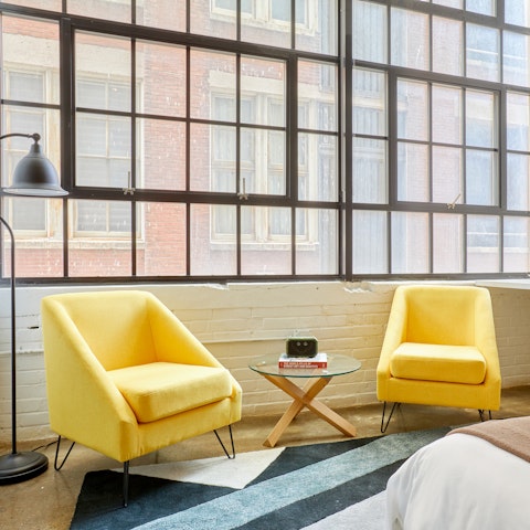 Enjoy a quiet read sunken into one of the mellow yellow upholsteries