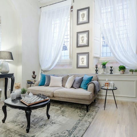 Find time to relax in the stylish living space, replete with artwork