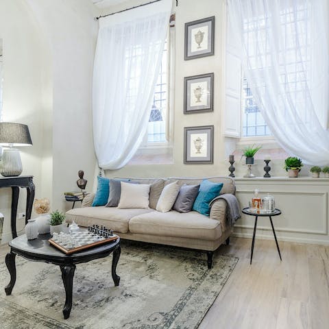 Find time to relax in the stylish living space, replete with artwork