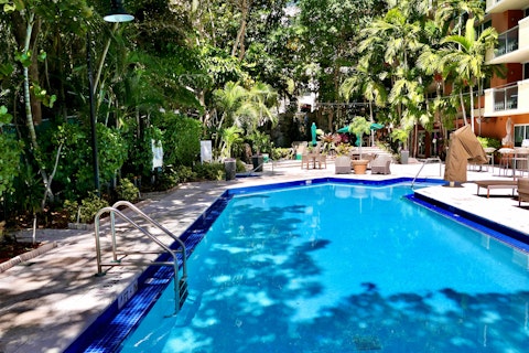 Cool off in the communal pool surrounded by dense tropical greenery