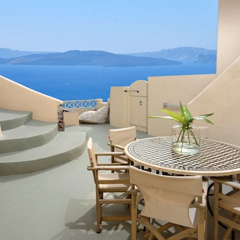 Savour an alfresco breakfast as you take in the inky blue sea views