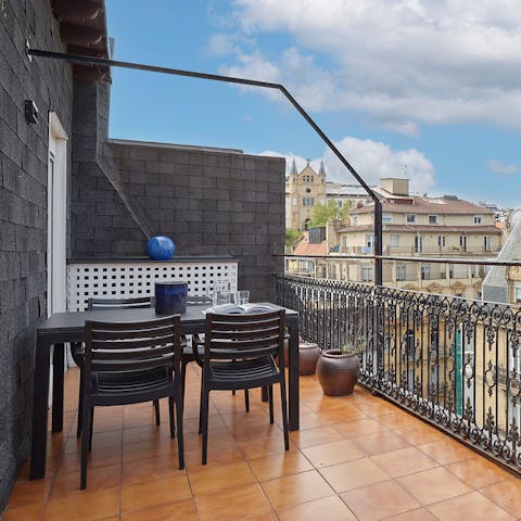 Tuck into alfresco feasts on the full-length balcony