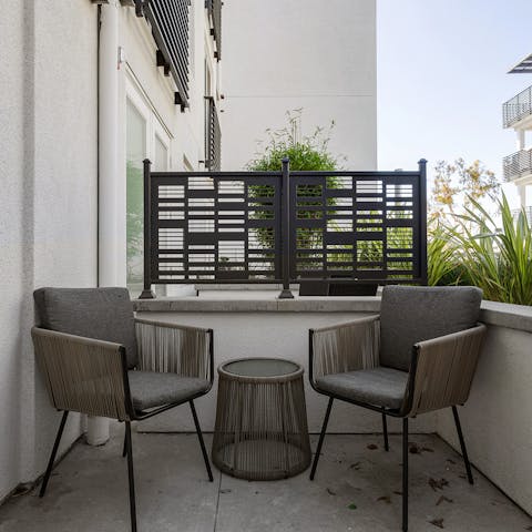 Finish evenings with a glass of wine on your private balcony
