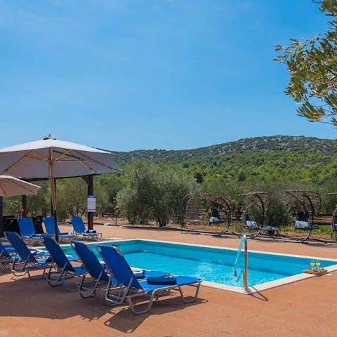 Soak up the sun and the mountain views by the pool