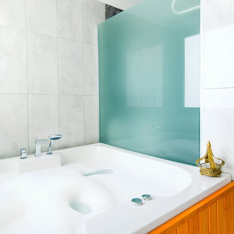 Run yourself a bath in the jacuzzi tub and ease back