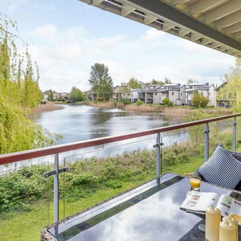 Savour the views across the lake from the balcony