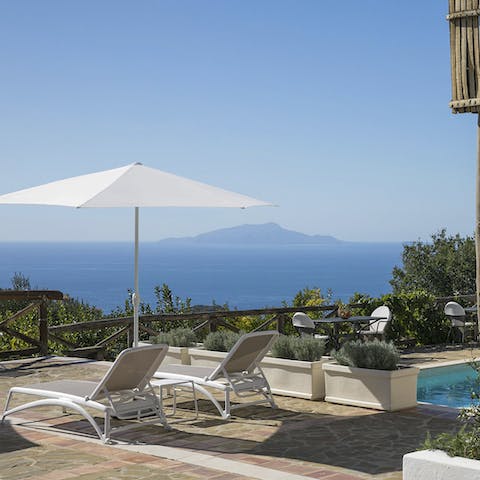 Bask in the sun on the loungers by the private pool and dry off after a swim